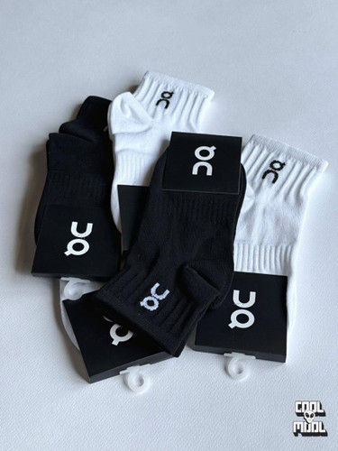 some on running socks in white and black