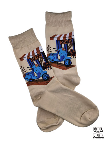 Classic blue Vespa scooter parked outside a vintage European cafe woven crew socks on beige cotton fabric.