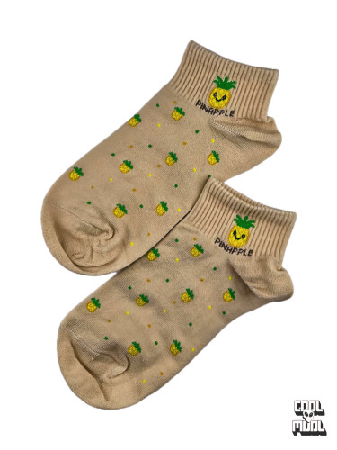 Cute beige cotton ankle socks featuring a repeating tiny pineapple pattern and a cool smiling pineapple wearing sunglasses on the cuff."